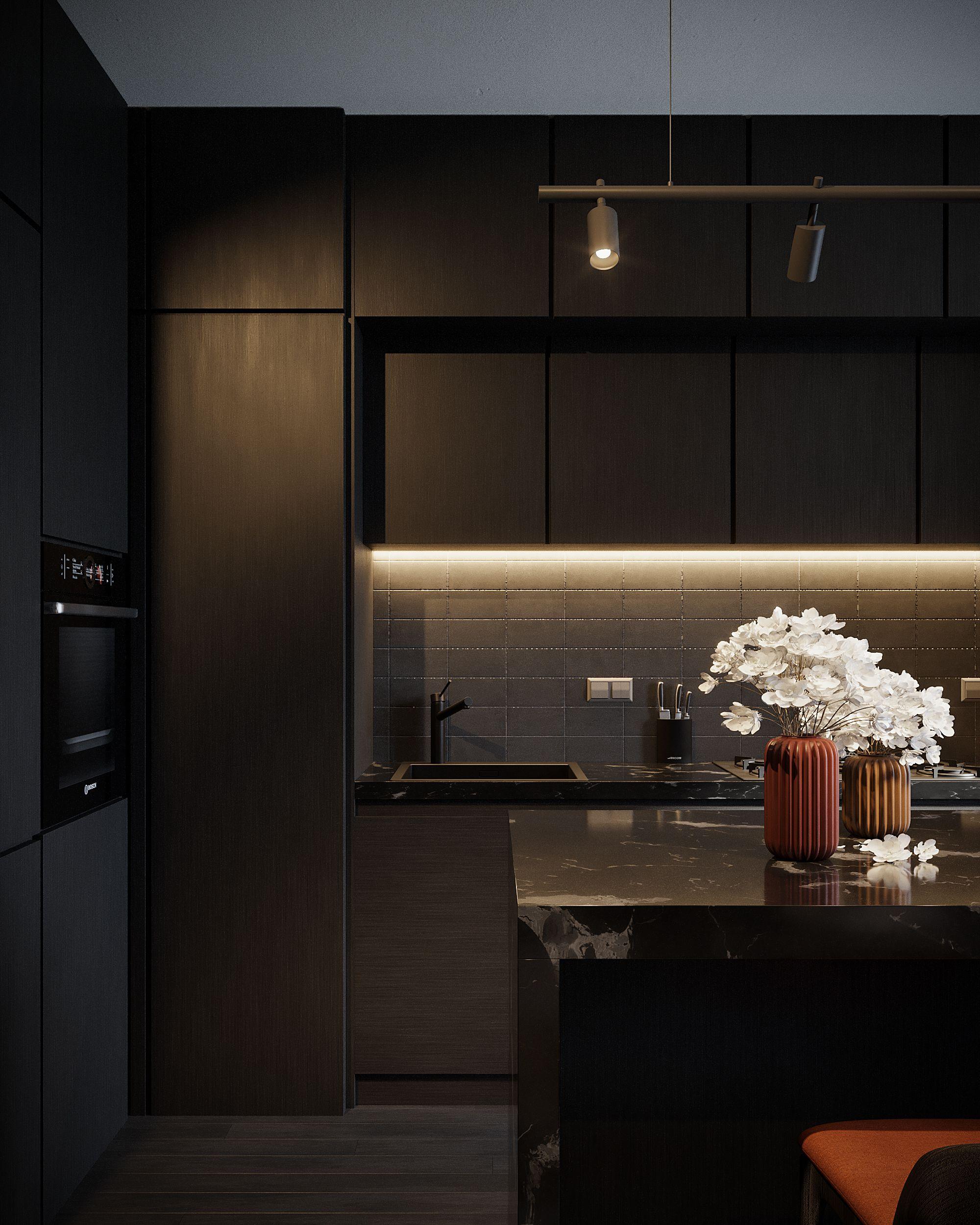 Black stone kitchen island with under-cabinet light